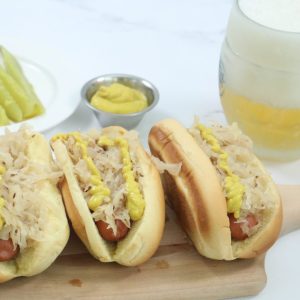 Hot dogs steamed in beer with sauerkraut